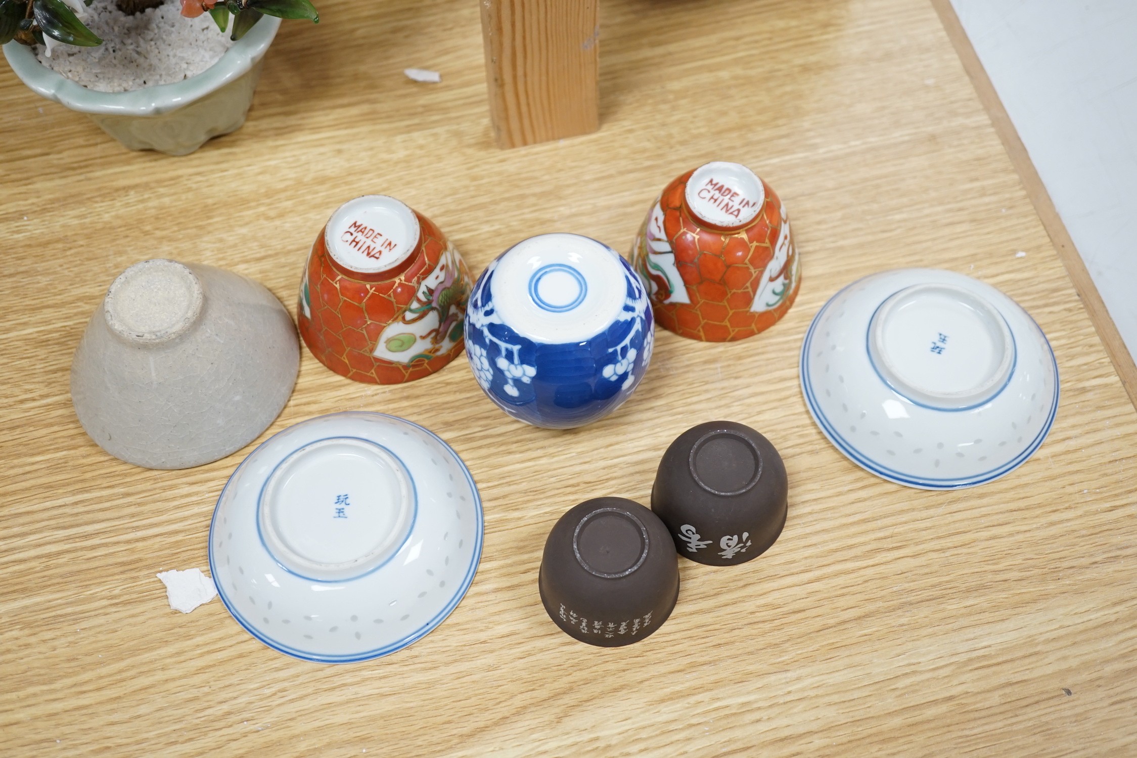 A group of various Chinese ceramics, to include a blue and white prunus jar, an earthenware dish, a famille rose jar and cover and others